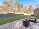 Private backyard featuring a stone patio with outdoor furniture and lush green grass at 2785 Disney Pl, Indian Land, SC 29707