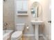 Cozy bathroom featuring a pedestal sink, white cabinets, and tile flooring at 2785 Disney Pl, Indian Land, SC 29707