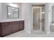 Bathroom featuring a vanity with dark wood cabinets and a glass-enclosed shower at 2785 Disney Pl, Indian Land, SC 29707