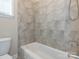 Cozy bathroom featuring a combined tub and shower with tile surround at 2785 Disney Pl, Indian Land, SC 29707
