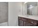 Bathroom with dark wood vanity and shower-tub combination at 2785 Disney Pl, Indian Land, SC 29707