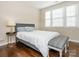 This bedroom features hardwood floors, a large window, and a comfortable bed at 2785 Disney Pl, Indian Land, SC 29707