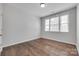 Cozy bedroom with natural light, hardwood floors, and neutral wall color at 2785 Disney Pl, Indian Land, SC 29707