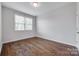Bright bedroom with hardwood floors, a window, and neutral wall color at 2785 Disney Pl, Indian Land, SC 29707