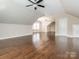 Bright bonus room featuring hardwood floors, natural light, and a ceiling fan at 2785 Disney Pl, Indian Land, SC 29707