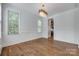 Dining room featuring hardwood floors, fresh paint, custom molding, and decorative lighting at 2785 Disney Pl, Indian Land, SC 29707