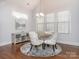 Bright dining room features a round table with stylish chairs and modern chandelier lighting at 2785 Disney Pl, Indian Land, SC 29707