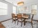 Elegant dining room with a wooden table, six chairs, and a modern chandelier at 2785 Disney Pl, Indian Land, SC 29707