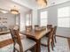 Well-lit dining space featuring a spacious wooden table and stylish chandelier at 2785 Disney Pl, Indian Land, SC 29707