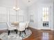 Well-lit dining room boasts a round table with upholstered chairs and access to the outdoors at 2785 Disney Pl, Indian Land, SC 29707