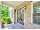 Inviting front entry with double doors, sidelights, brick facade, and custom door mat at 2785 Disney Pl, Indian Land, SC 29707