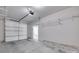 Spacious garage with concrete floors, shelving, and automatic door at 2785 Disney Pl, Indian Land, SC 29707