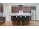 Kitchen with stainless appliances, center island with seating, and custom cabinetry at 2785 Disney Pl, Indian Land, SC 29707