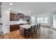 Open concept kitchen featuring a large center island, stainless appliances, and hardwood flooring at 2785 Disney Pl, Indian Land, SC 29707