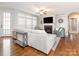 Spacious living room features hardwood floors, a fireplace, and large windows that provide plenty of natural light at 2785 Disney Pl, Indian Land, SC 29707