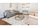 Comfortable living room with a gray sofa, stylish rug, and modern decor at 2785 Disney Pl, Indian Land, SC 29707