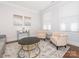 Bright living area with elegant decor, including armchairs and a mirrored console table at 2785 Disney Pl, Indian Land, SC 29707
