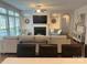 Large living room with a fireplace, TV, and open floor plan, featuring hardwood floors and lots of natural light at 2785 Disney Pl, Indian Land, SC 29707