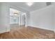 Spacious living room featuring hardwood floors, fresh paint, and decorative lighting at 2785 Disney Pl, Indian Land, SC 29707