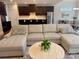 Open-concept living room with a large sectional sofa and a view of the kitchen and dining area at 2785 Disney Pl, Indian Land, SC 29707