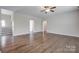 Bright living room with hardwood floors, a ceiling fan, and neutral paint at 2785 Disney Pl, Indian Land, SC 29707