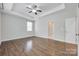 Spacious bedroom with hardwood flooring, modern ceiling fan, and neutral color palette at 2785 Disney Pl, Indian Land, SC 29707