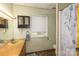 Bathroom featuring a sink, toilet, shower with floral curtain, window and medicine cabinet at 310 Yarbro Rd, Kings Mountain, NC 28086
