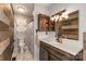 Charming bathroom featuring a wood accent wall, custom vanity, and modern fixtures at 310 Yarbro Rd, Kings Mountain, NC 28086