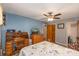Inviting bedroom with a ceiling fan, neutral paint, closet, and a cozy area for a desk and chair at 310 Yarbro Rd, Kings Mountain, NC 28086
