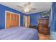 Bright bedroom with a ceiling fan, updated closet, and an accent wall at 310 Yarbro Rd, Kings Mountain, NC 28086