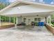 View of the spacious carport with an adjacent utility room and an abundance of storage options at 310 Yarbro Rd, Kings Mountain, NC 28086