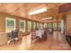 Large open space with wood flooring, wooden walls and multiple tables and chairs at 310 Yarbro Rd, Kings Mountain, NC 28086