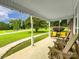 Covered porch with chairs, with a view of a well-maintained lawn and landscaping at 310 Yarbro Rd, Kings Mountain, NC 28086