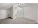 Versatile attic space with carpet and neutral paint; bonus room ready for personalization and easy access to a bathroom at 3104 Doncaster Dr, Rock Hill, SC 29732