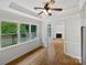 Inviting living room with hardwood floors, large windows, and a cozy fireplace in the adjacent room at 3104 Doncaster Dr, Rock Hill, SC 29732
