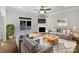 Comfortable living room with fireplace, ceiling fan, and access to the outdoor patio at 3104 Doncaster Dr, Rock Hill, SC 29732
