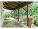 View of the spacious back deck with lush greenery, great for outdoor entertaining and relaxation at 3236 Wicklow Ln, Clover, SC 29710