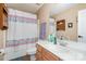 Well-lit bathroom with a shower/tub combo, updated vanity, and ample storage space at 3236 Wicklow Ln, Clover, SC 29710