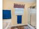 Bright bathroom featuring a glass-enclosed shower, tiled floor, and a neutral color scheme at 3236 Wicklow Ln, Clover, SC 29710