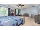 Spacious bedroom with a ceiling fan, natural light, and a mini fridge at 3236 Wicklow Ln, Clover, SC 29710