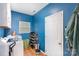 Bright laundry room with modern appliances, ample storage, and durable tile flooring at 3236 Wicklow Ln, Clover, SC 29710