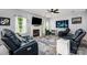 Comfortable living room with fireplace, large TV, and bright, natural light at 3236 Wicklow Ln, Clover, SC 29710