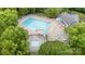 An aerial shot showcases the community pool featuring lap lanes, lounge chairs, and tables at 3236 Wicklow Ln, Clover, SC 29710
