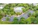 Aerial view of a community pool, clubhouse, and parking lot nestled among lush trees at 3236 Wicklow Ln, Clover, SC 29710