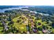 Beautiful aerial view of the neighborhood highlighting the lush trees, proximity to water, and custom houses at 332 Canvasback Rd, Mooresville, NC 28117