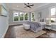 This spacious bedroom features a trey ceiling, ceiling fan, and plenty of natural light at 332 Canvasback Rd, Mooresville, NC 28117