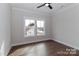 Bedroom showcasing a hardwood floor, a modern fan, and plenty of natural light at 332 Canvasback Rd, Mooresville, NC 28117