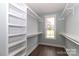 A walk-in closet features custom shelving and hanging racks at 332 Canvasback Rd, Mooresville, NC 28117