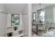 Bright dining room featuring a wooden table, modern chandelier, and neutral décor at 332 Canvasback Rd, Mooresville, NC 28117