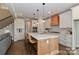 Bright kitchen with an island, stainless steel appliances, and hardwood floors at 332 Canvasback Rd, Mooresville, NC 28117